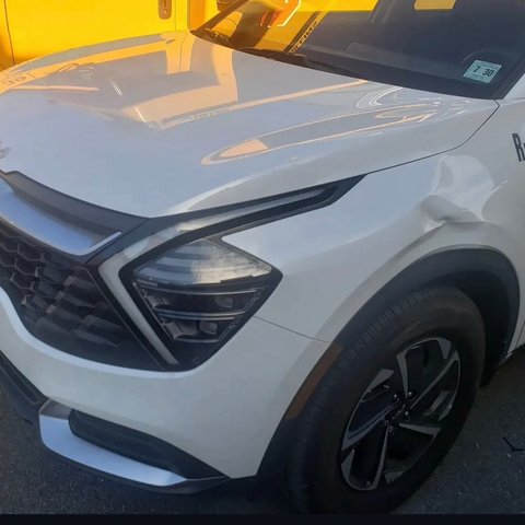 Before: front-end collision damage on a white Kia Sportage, Kearny NJ
