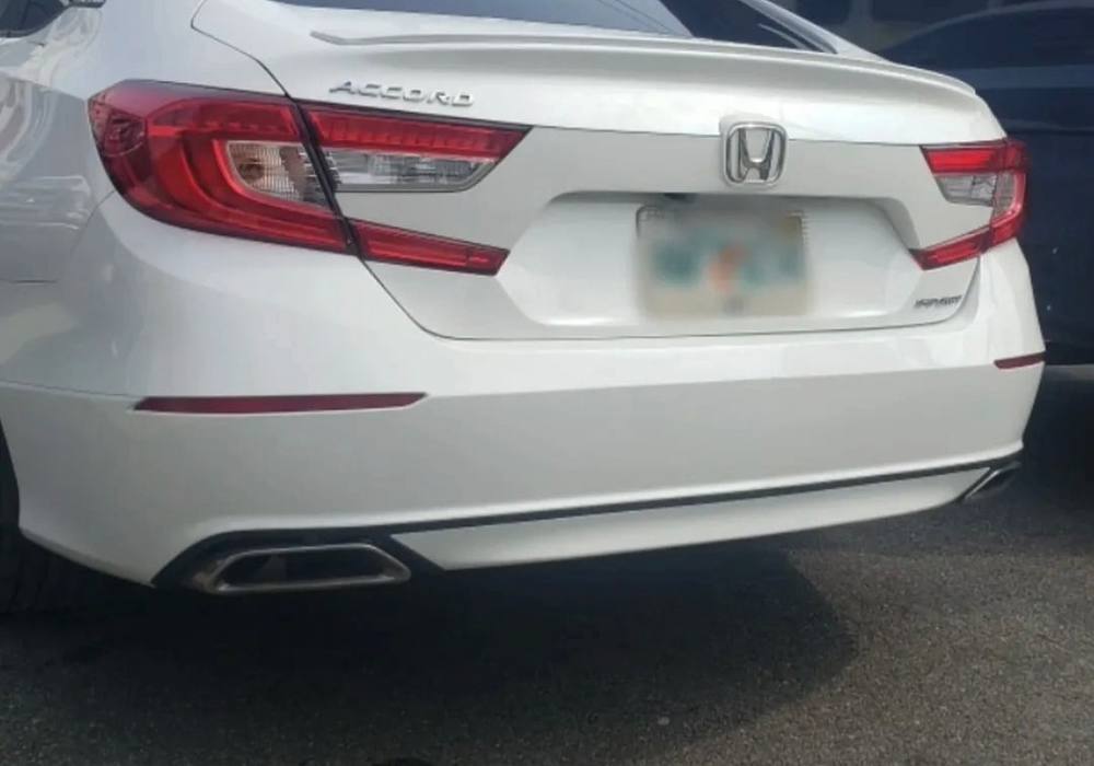 White Honda Accord with its rear bumper repaired and repainted at Mickey's Auto Body in Kearny, NJ