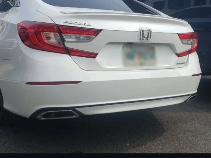 After: the same white Honda Accord with the rear bumper repaired and repainted