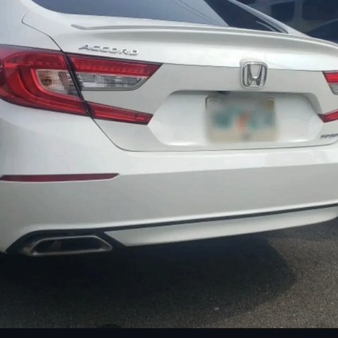 After: the same white Honda Accord with the rear bumper repaired and repainted