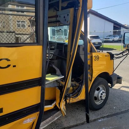 Before: front-end collision damage on a yellow Collins school bus, Kearny NJ