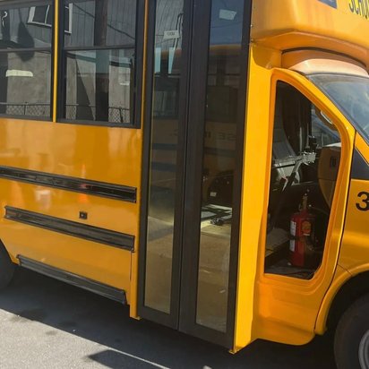 After: the same yellow Collins school bus body repaired and repainted