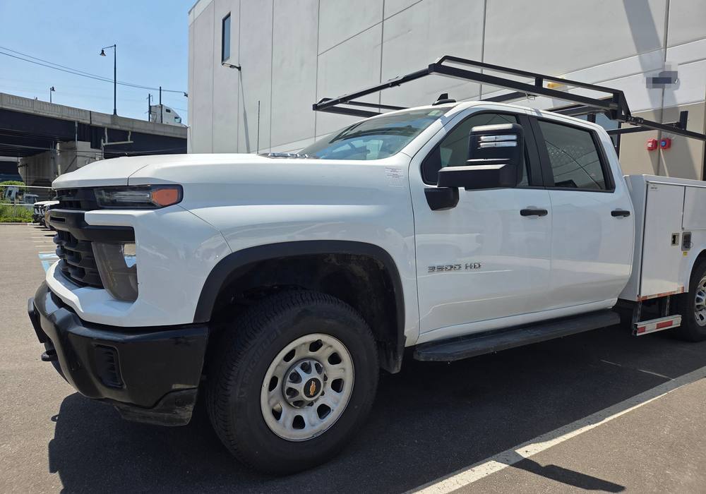 White Chevrolet Silverado 3500HD restored to a factory finish at Mickey's Auto Body, the collision repair shop serving Harrison, NJ