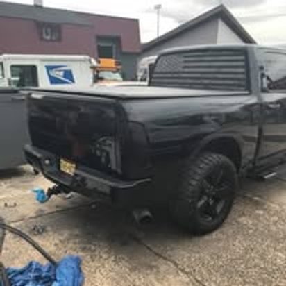 Black Ram pickup truck after commercial collision repair at Mickey's Auto Body, Kearny NJ