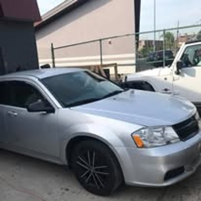 After: the same silver Dodge Avenger repaired and refinished at Mickey's Auto Body