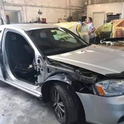 Before: front-end collision damage on a silver Dodge Avenger, Kearny NJ