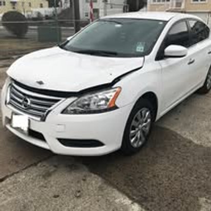 Before: front-end collision damage on a white Nissan Sentra, Kearny NJ