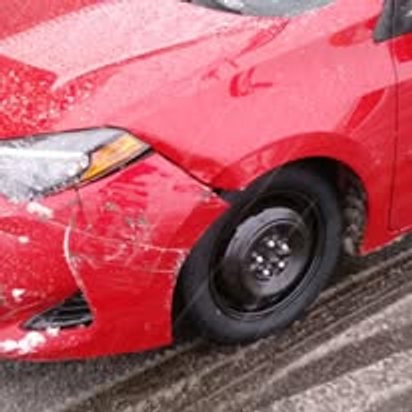 Before: front-end collision damage on a red Toyota Corolla, Kearny NJ