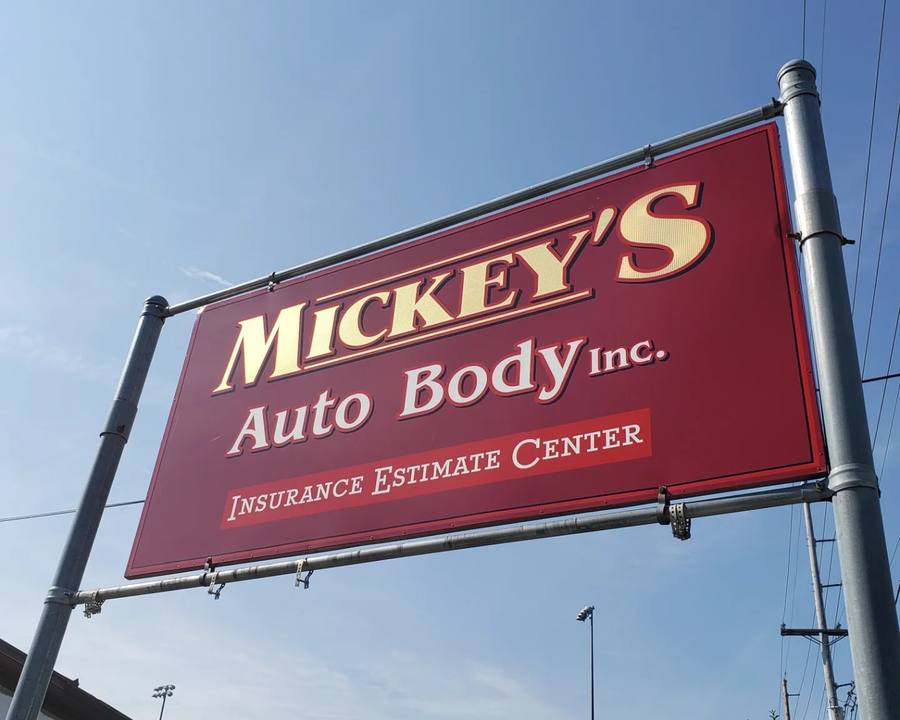 Mickey's Auto Body sign at the auto body shop on Schuyler Avenue in Kearny, NJ